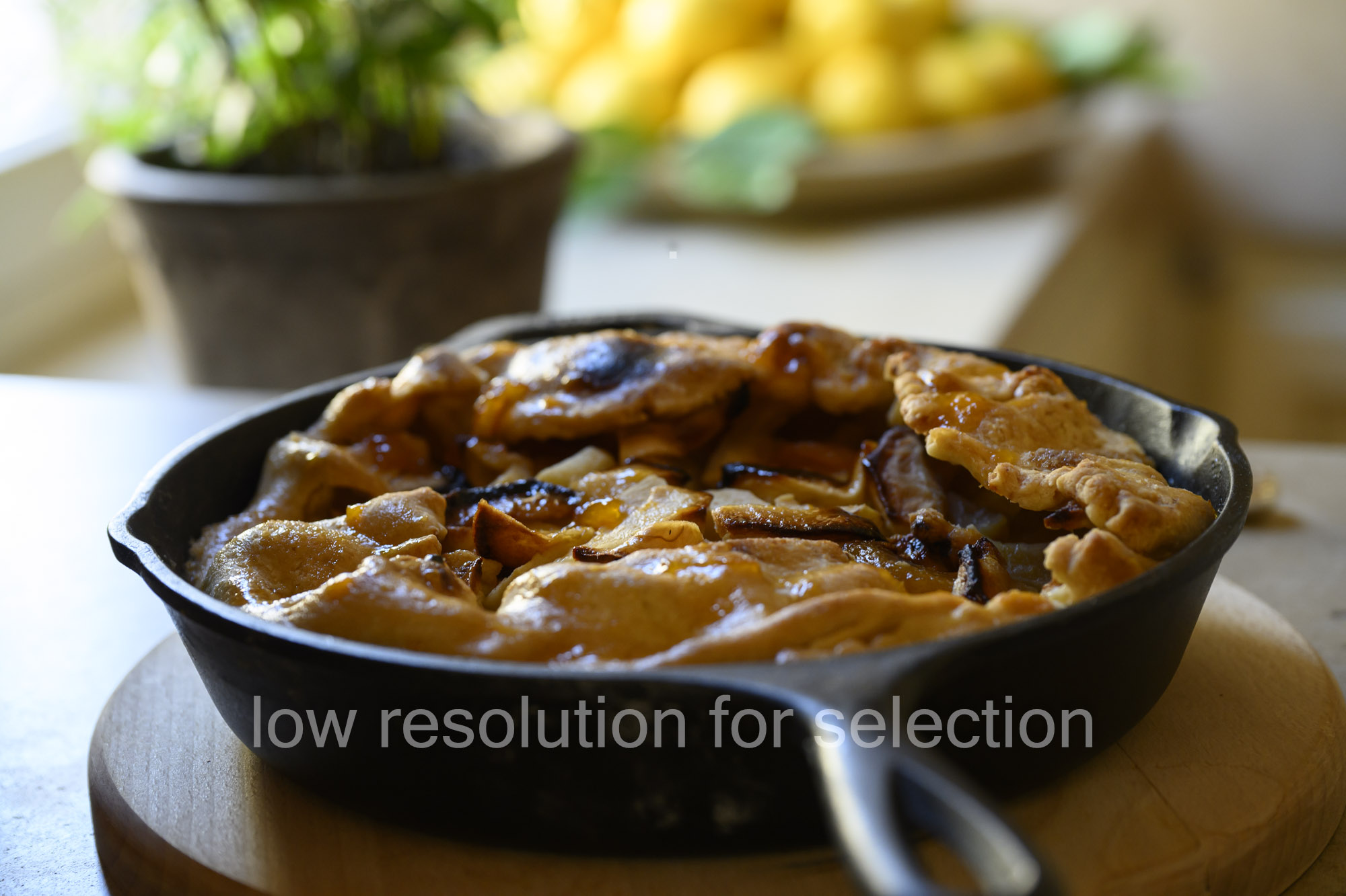 Fruit pie baked in a black cast iron skillet.